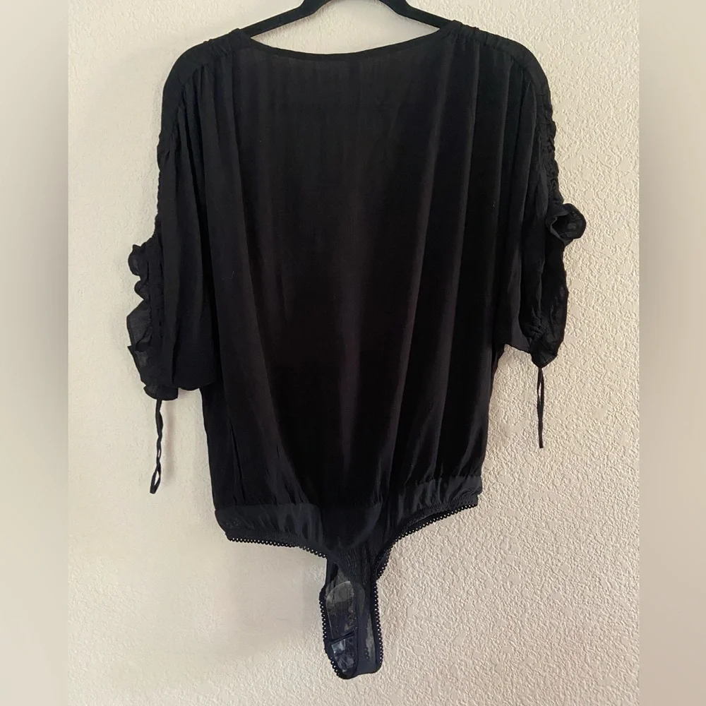 Free People Cleo Bodysuit Tie Cutout  Black V Neck Short Sleeve Ruffle S NWOT